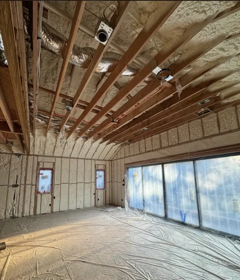 Interior walls and ceiling insulated with spray foam during new construction in Bow